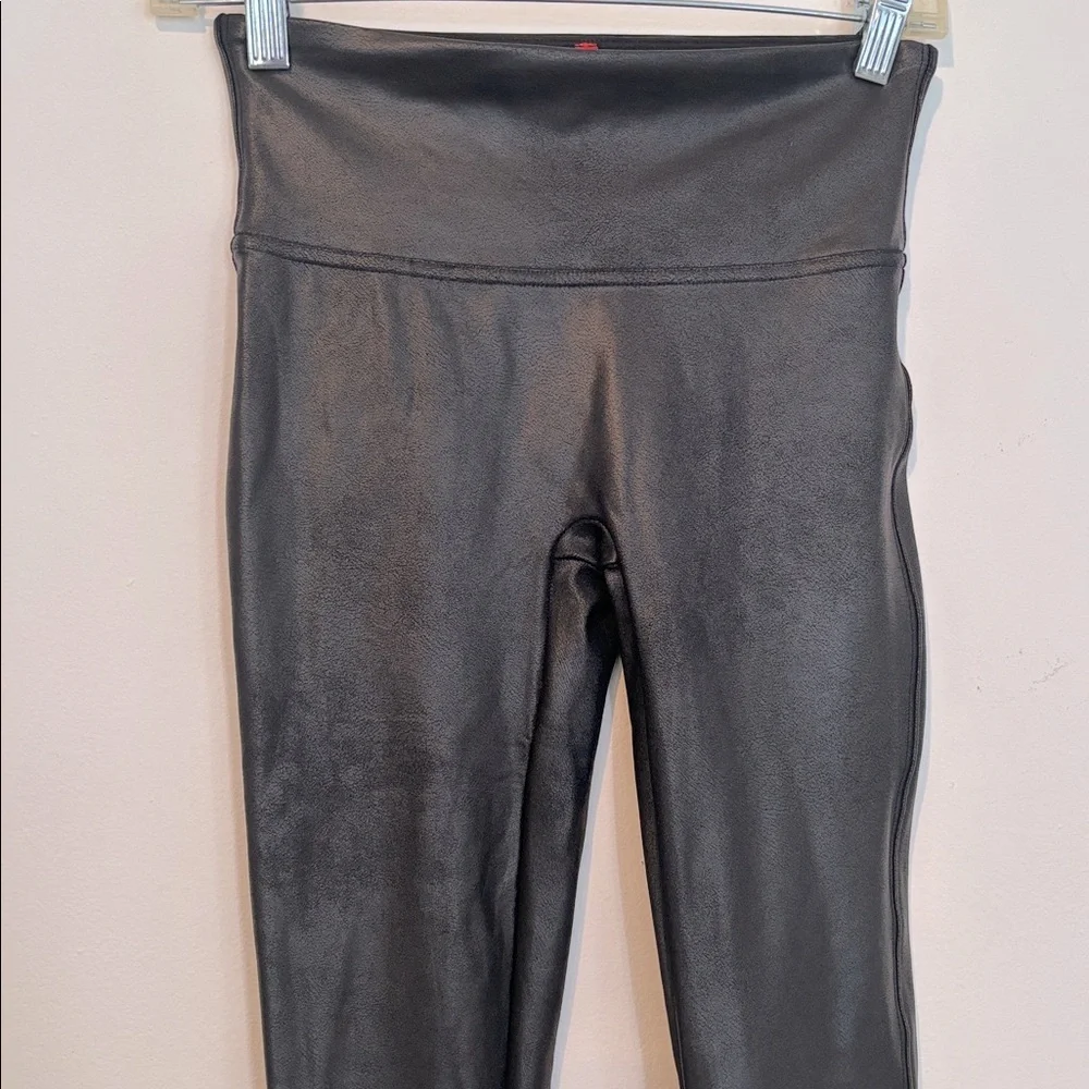 Spanx Women’s Black Faux Leather Leggings in a size Small.